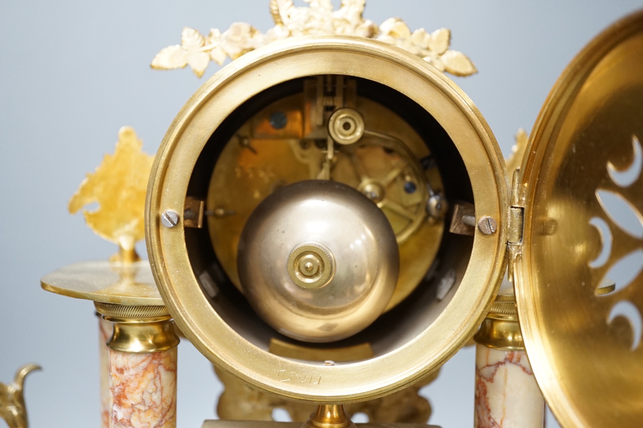 A French gilt metal and marble clock garniture, 38cm